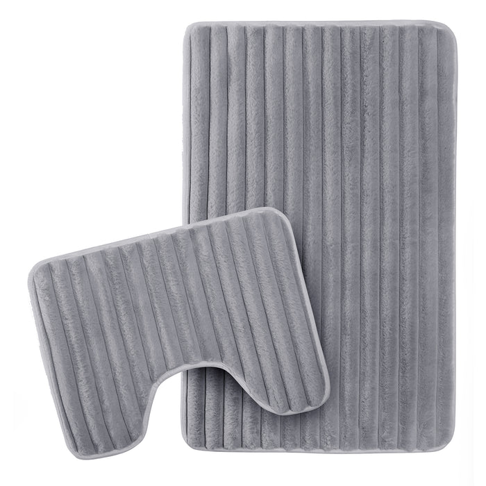 OLIVIA ROCCO 2-piece ribbed charcoal bath mat set with extra soft, non-slip, super absorbent bath mats on a bathroom floor.