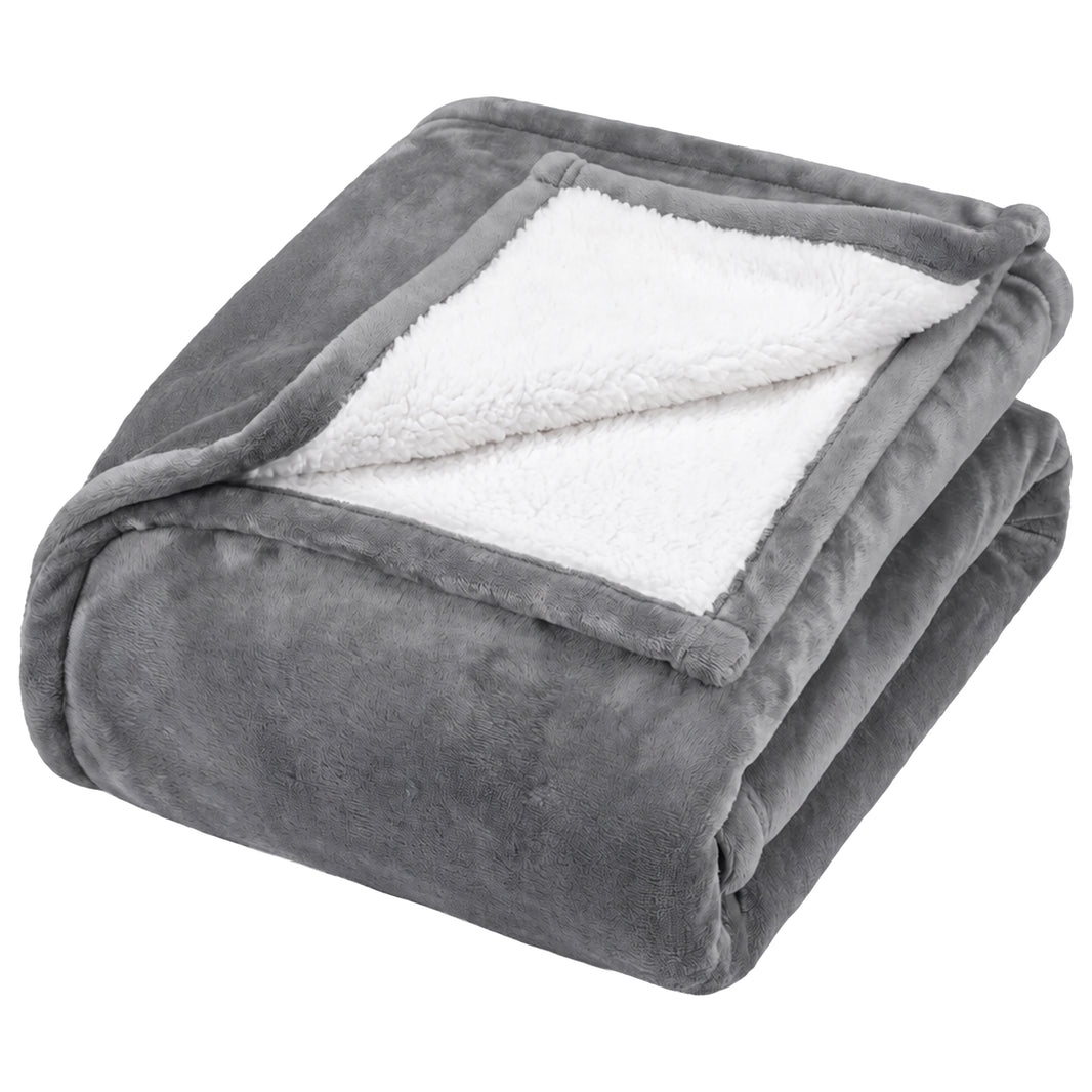 Grey Heatwave self heating blanket folded to show the white sherpa fleece reverse