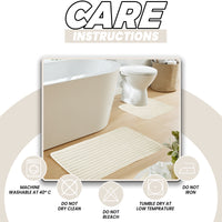 OLIVIA ROCCO two-piece ribbed bath mat set in cream, soft, non-slip, super absorbent, and easy to clean for bathroom comfort.