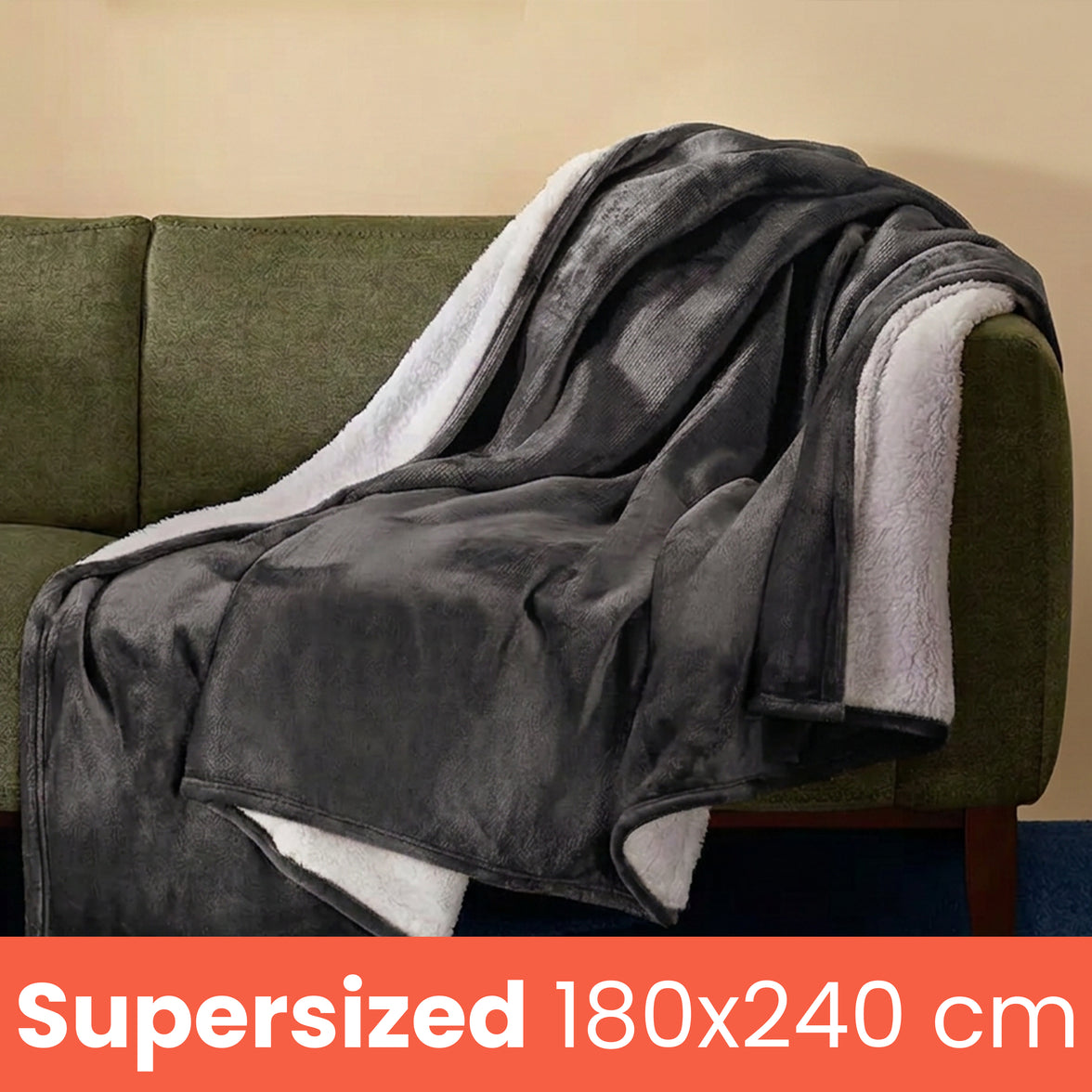 Giant 180 x 240 cm grey self heating blanket draped over a sofa
