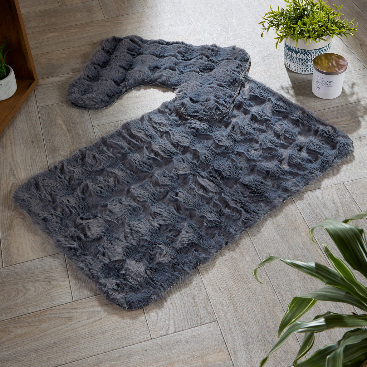 OLIVIA ROCCO 2-piece bath mat set with plush, quick-dry, non-slip bath rugs, featuring soft, absorbent fabric for bathroom comfort.